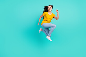 Canvas Print - Full size profile photo of joyful young lady jump wear yellow t-shirt jeans isolated on teal color background