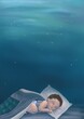 © Natalya - Baby boy sleeping at night dreaming of ocean