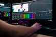 Back view of a young white man video editor