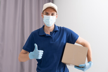 Wall Mural - Man from delivery service in t-shirt, in protective mask and gloves giving food order and holding boxes over white background.