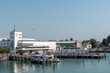 The harbor from the German city Friedrichshafen at the lake constance with ships and zeppelin in the background.