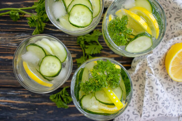 Wall Mural - glass of water, lemon, cucumber, parsley
