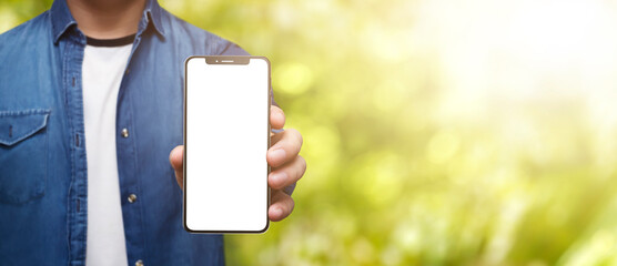 Man holding cell phone in hand with beautiful sunny day - easy modification
