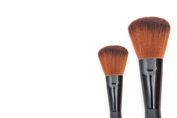 Poster - Makeup brushes on white background.	