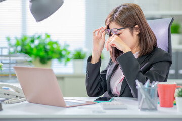 Canvas Print - Asia woman worker feel tired