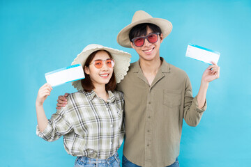 Wall Mural - Young Asian couple happily traveling together