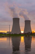 © wlad074 - Nuclear power plant against sky by the river at sunset
