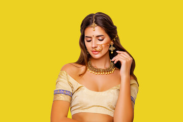 Close up Beauty Portrait indian girl.  Jewelry. Young Hindu woman model with kundan jewelry set. Red lips. Close up. Traditional India costume lehenga choli or sari. make-up 
