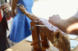 © Cubodeluz - Waiter cutting Spanish Iberian ham at an event