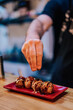 © ADDICTIVE STOCK - Unrecognizable man preparing Asian dish in cafe