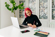 © ADDICTIVE STOCK - Pensive fashion designer working at home