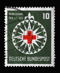 Stamp printed in Germany, shows symbol of the Red Cross in a stylized wind rose, circa 1953