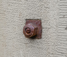 Large Rusty Red Metal Nut On An Old 19th Century Wall