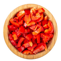 Wall Mural - Sliced red bell pepper in a wooden bowl isolated on white background. Fresh and healthy vegetables. Top view.