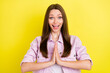 © deagreez - Photo portrait smiling girl keeping hands together asking wish isolated bright yellow color background