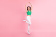 Full length body size photo smiling jumping up dancing like ballerina isolated pastel pink color background