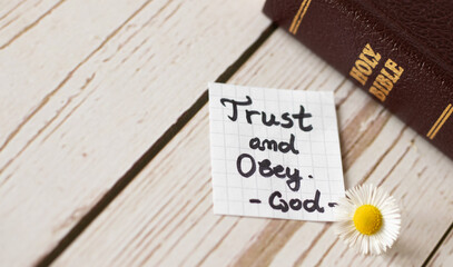 Wall Mural - Trust and obey God and Jesus Christ. Biblical concept about complete faith, hope belief in God's Word, Holy Bible. Blessings from obedience.