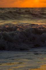 Wall Mural - Amazing sea sunset, the sun, waves, clouds