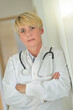 © ElitProd - Portrait of a female doctor with his stethoscope and his uniform