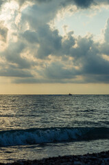 Wall Mural - Amazing sea sunset, the sun, waves, clouds