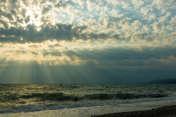 Wall Mural - Amazing sea sunset, the sun, waves, clouds