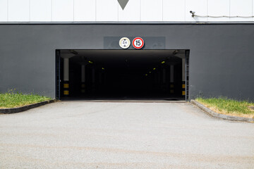 Poster - Empty entrance to the underground car park with street on foreground