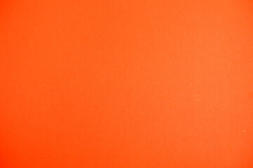 Orange background. Cardboard texture. Volume.