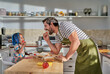 © Trevor Adeline/Caia Image - Father and daughter eating at kitchen island