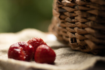 Wall Mural - fruit basket, strawberries on the table. also separate strawberries. Place for text
