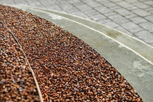 Coating Of The Stairs With Small Red Pebble Stones For Creative Design. Selective Focus.