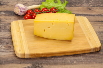 Wall Mural - Hard yellow tasty cheese brick