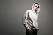 © eugenepartyzan - Man in Hood and sunglasses. stylish Boy in a hooded sweatshirt