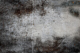 Fototapeta  - Porysowana, skorodowana tekstura, tło starego muru ogrodzeniowego. Kolory korozji w stonowanych odcieniach szarości.
