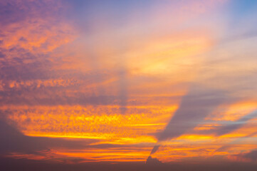 Wall Mural - beautiful vivid sky painted by the sun leaving bright golden shades.dense clouds in twilight sky in 