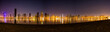 Beautiful panoramic shot of Sharjah Skyscraper or Skyline. A view from Al Mamzar Beach Dubai at night.