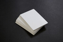 Stack Of Empty White Cards On The Black Table
