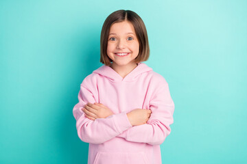 Wall Mural - Photo of bob hairdo small girl crossed arms wear pink sportswear isolated on teal color background