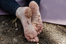 Closeup Shot Of A Female's Dirty Feet After Exercising In A Park