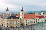 Fototapeta Miasto - Aerial view of ancient part of Sibiu in Romania, red roofs town in summer day