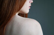 © Axel Bueckert - young woman showing bare shoulder with freckles on skin