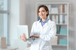 © Pixel-Shot - Female doctor using laptop in clinic