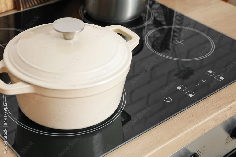 Cooking pot on kitchen stove, closeup