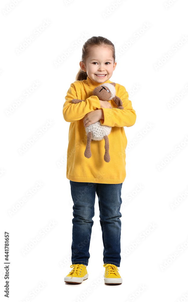 Cute little girl with toy on white background