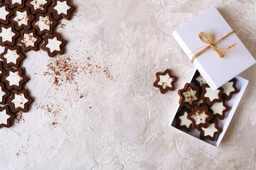 Wall Mural - Chocolate cookies with cream packed in a white box, light background, copy space, holiday Chocolate Day, Christmas