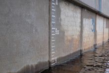 Water Level Measurement Gauge During Flood. Depth Marker On The Wall. Water Level Scale In The Town. Flood Disaster.