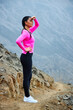 © Javinunezperu - mature woman meditating on the mountain in sportswear