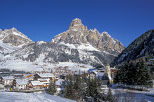Italy, Dolomites, Village Covered With Snow In Mountain Valley