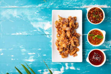 Wall Mural - Crispy fried sliced belly pork with spicy sauce