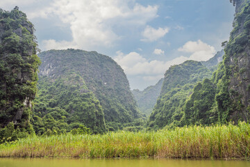 Trang An, Tam Coc, Ninh Binh, Viet nam. It's is UNESCO World Heritage Site, renowned for its boat cave tours. It's Halong Bay on land of Vietnam. Vietnam reopens borders after quarantine Coronovirus