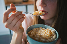 Crop Woman Eating Delicious Cereal For Breakfast At Home